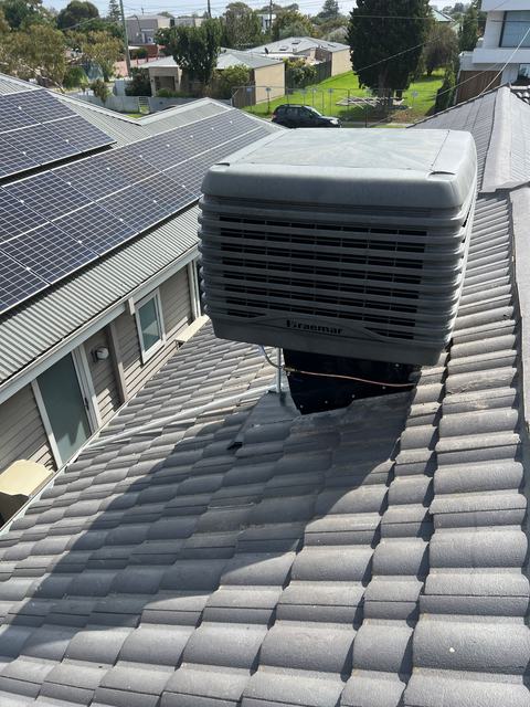 Braemar evaporative cooler on a tiled roof