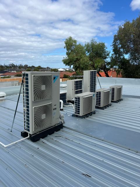 Multiple Daikin units on a commercial rooftop